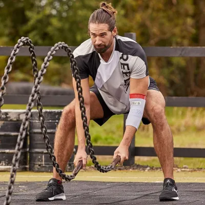 Фіксатор ліктя Reebok Speedwick Elbow Support білий, червоний Уні M RRSU-14523 M - 1 - Robinzon.ua