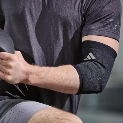 Фіксатор ліктя Adidas Performance Elbow Support чорний Уні M ADSU-13332 M - 1 - Robinzon.ua